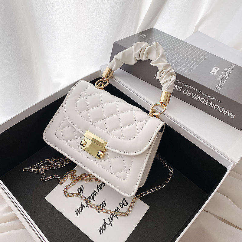 The Lyra Quilted Top-Handle Bag